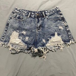 Ripped, high-waisted denim shorts